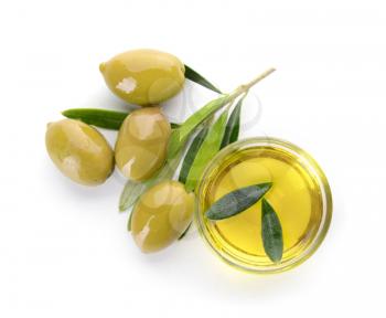 Bowl of tasty olive oil on white background�