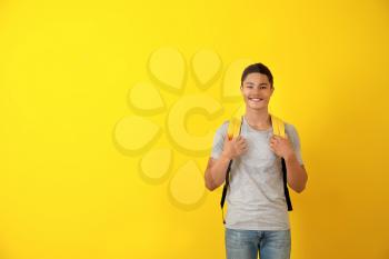African-American teenage boy on color background�