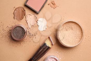 Different cosmetic products on color background�