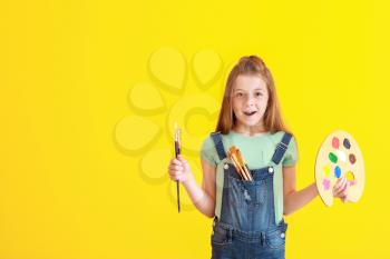 Cute little artist on color background�