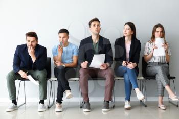 Young people waiting for job interview indoors�