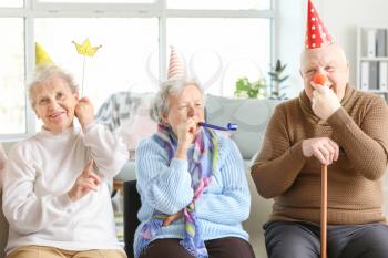Happy senior people spending time together in nursing home�