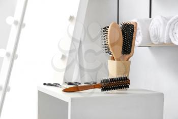 Stand with hairdresser tools in beauty salon�