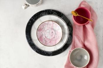 Ceramic plates and cups on table�