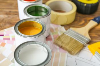 Cans of paint on table, closeup�