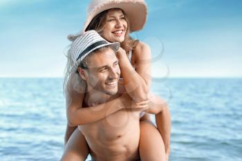 Happy young couple at sea resort�