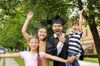 Happy man with his family on graduation day�