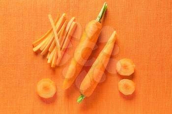 Fresh carrots on color background�