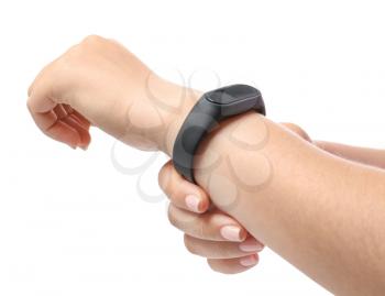 Woman with fitness band checking her pulse on white background�