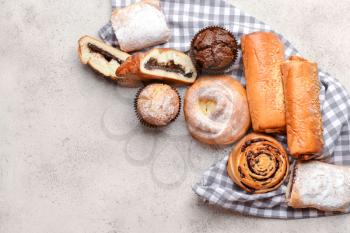 Heap of tasty pastries on grey background�