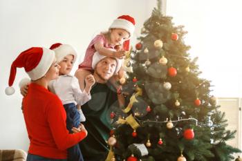 Happy family at home on Christmas eve�