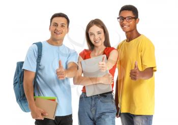 Portrait of young students showing thumb-up on white background�