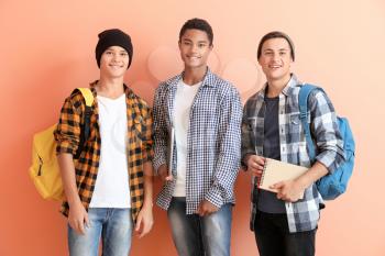 Portrait of young students on color background�