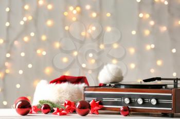 Record player and Christmas decor on table�