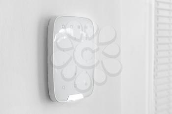 Panel of modern security system on wall indoors�