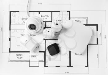 Different equipment of security system on home plan�