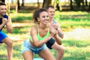 Young African-American woman training outdoors�