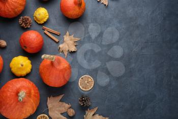 Autumn composition with fresh pumpkins on color background�