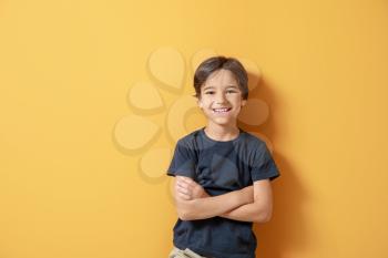 Cute little boy on color background�