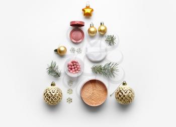 Christmas composition with decorative cosmetics on white background�