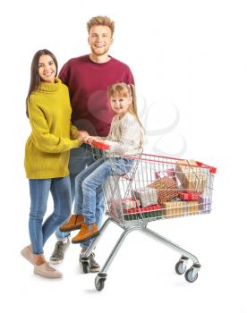 Family with shopping cart full of Christmas gifts on white background�