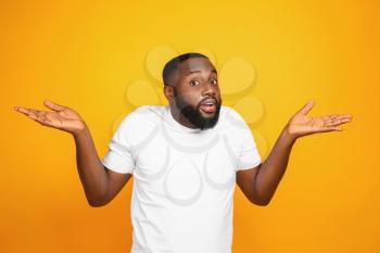Helpless African-American man on color background�