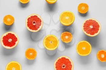 Sweet citrus fruits on color background�