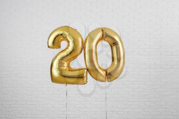 Figure 20 made of balloons on light background�