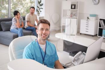Portrait of male receptionist in clinic�