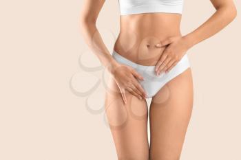 Young woman on light background, closeup. Gynecology concept�