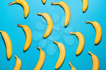 Ripe bananas on color background�