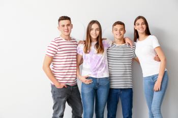 Portrait of cool teenagers on white background�