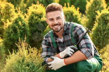 Portrait of handsome male gardener outdoors�