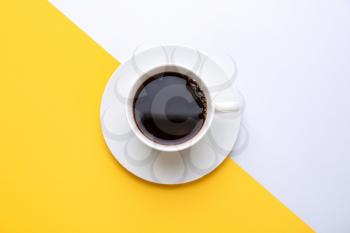 Cup of hot coffee on color background�