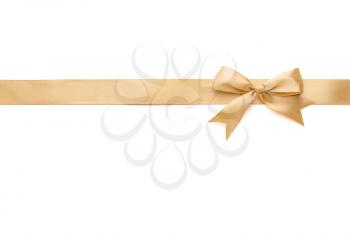 Golden ribbon with beautiful bow on white background�