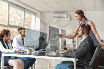 Technical support agents working in office�