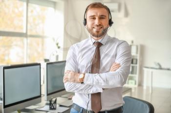 Portrait of male technical support agent in office�