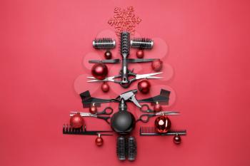 Beautiful Christmas tree made of hairdresser tools on color background�