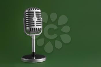 Retro microphone on color background�