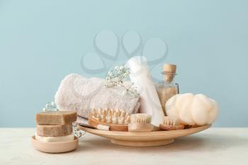 Set of bath accessories on white table�