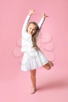 Cute little girl on color background�