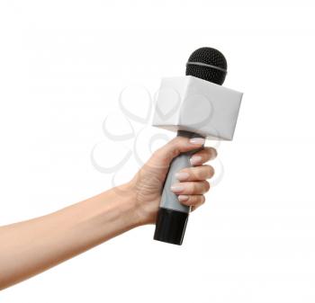 Journalist's hand with microphone on white background�