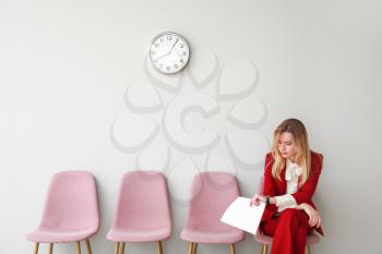 Young woman waiting for job interview indoors�