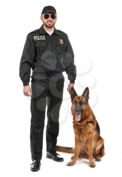 Male police officer with dog on white background�