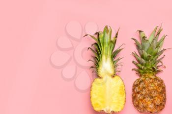 Fresh ripe pineapples on color background�