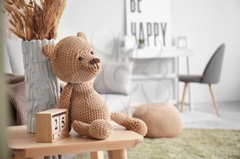 Cuddly toy on table in room�