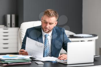 Male accountant working in office�