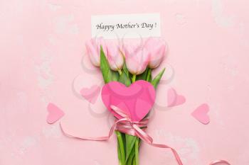 Beautiful flowers and card for Mother's Day on color background�