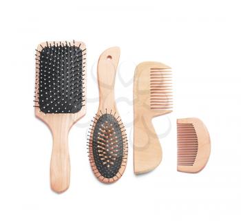 Hair brushes and combs on white background�