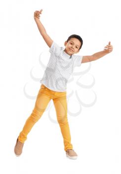 Little African-American boy dancing against white background�